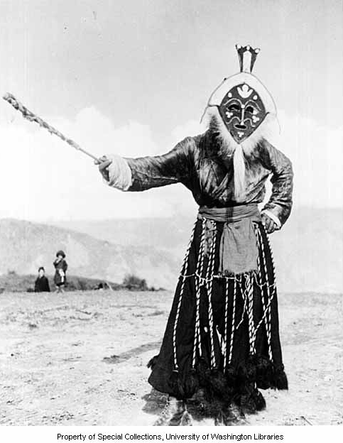 Monpa dancer wearing felt mask with cowrie shells, Shyo village, Northeast Frontier Agency, India, ca. 1954